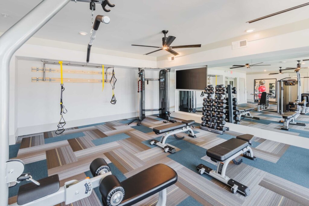 free weights area at the pine 25 apartments charlotte's gym