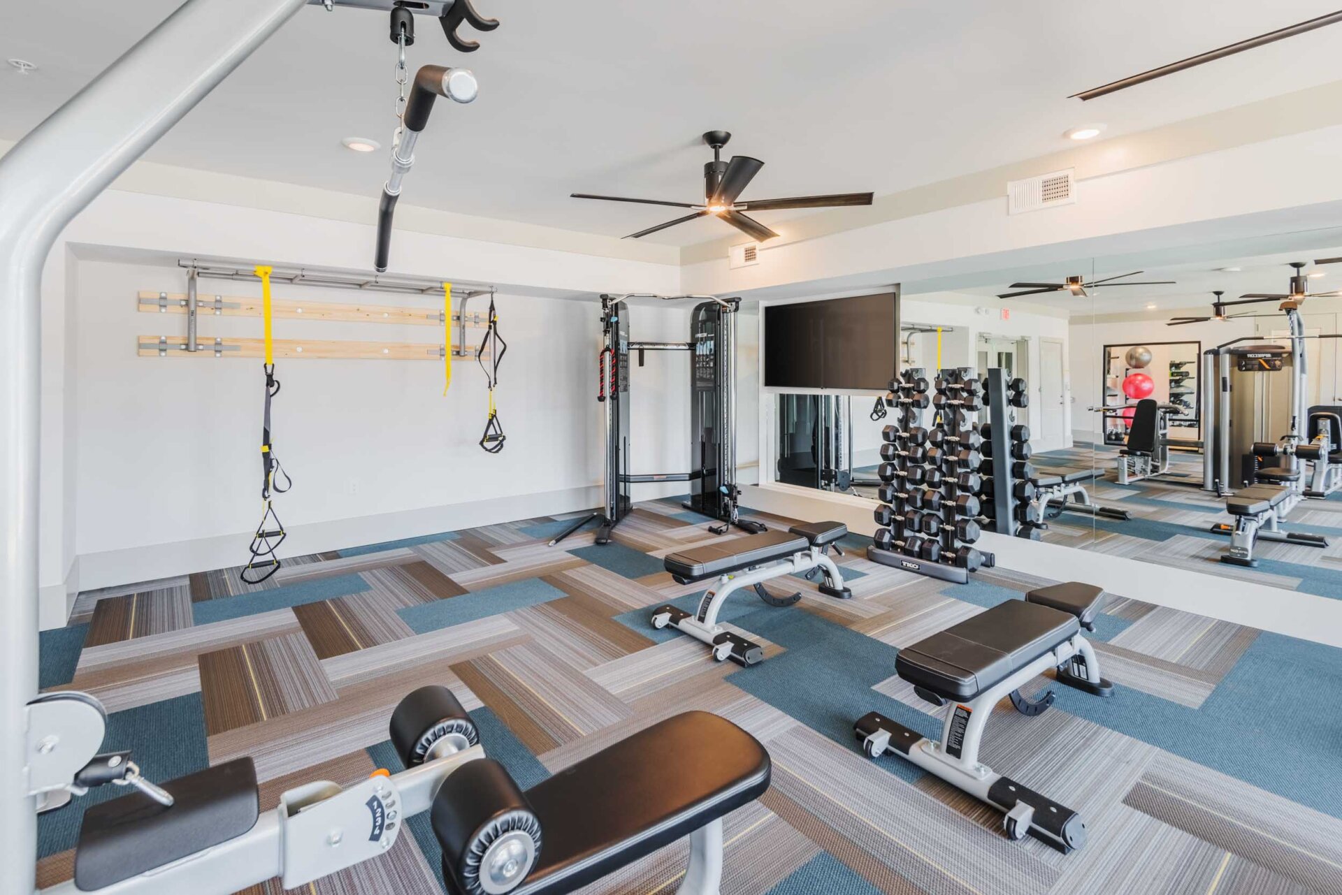 free weights area at the pine 25 apartments charlotte's gym